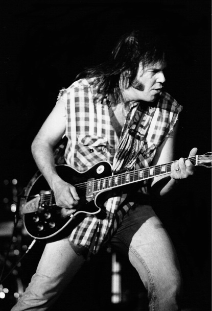 Neil Young playing electric guitar chess shirt