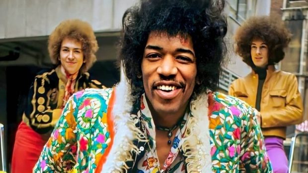 Jimi Hendrix with his signature psychedelic and floral attire. A iconic 60s style.