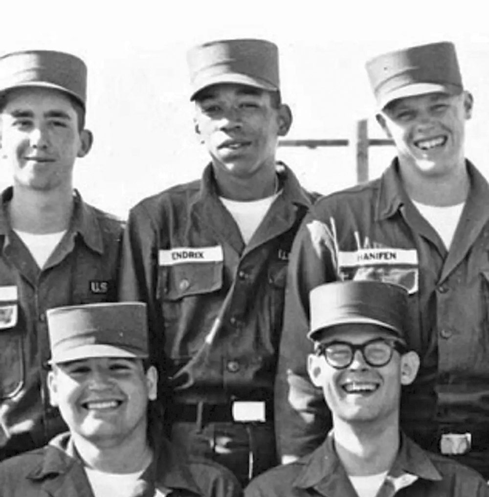 Black and white photograph of Jimi Hendrix in 1961, dressed in US Army uniform.