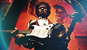 A wallpaper featuring Jimi Hendrix set against a cosmic, science fiction-inspired backdrop.