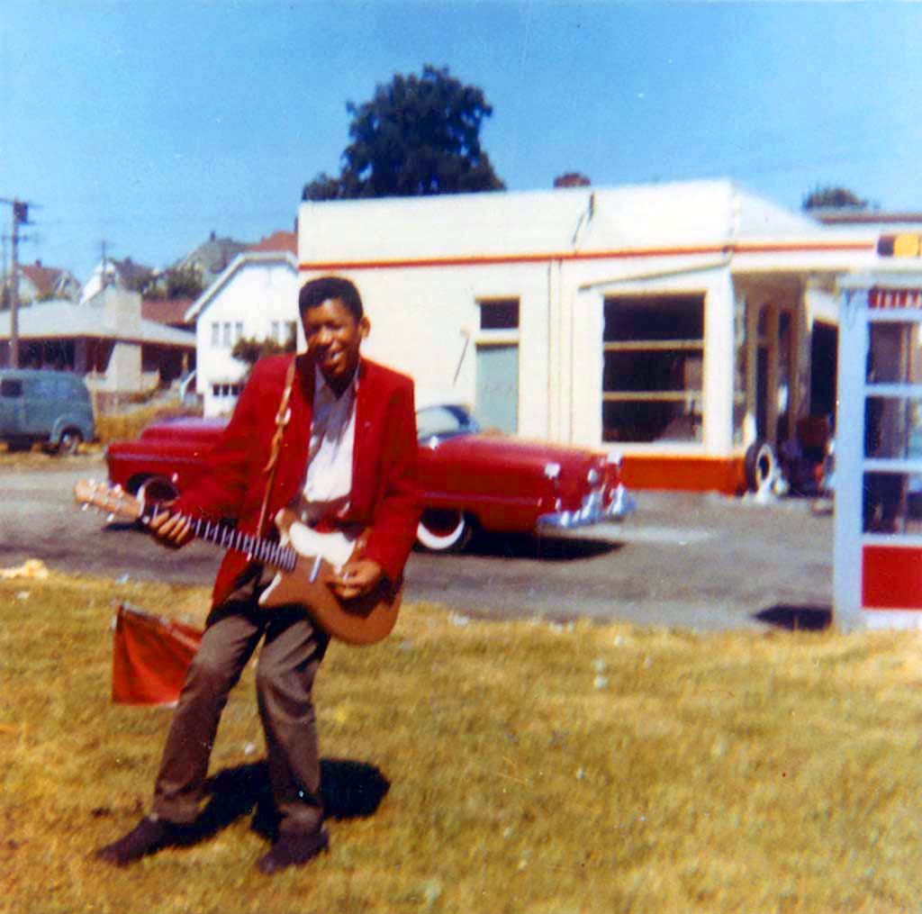 Young Jimi Hendrix with a red Danelectro, 1958.