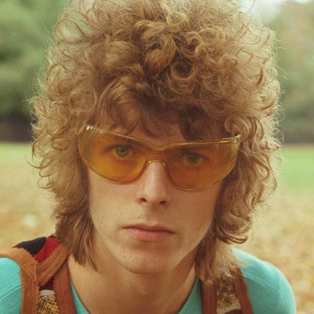 David Bowie, adorned with yellow glasses, "Space Oddity" and Major Tom era, in Hyde Park, 1969