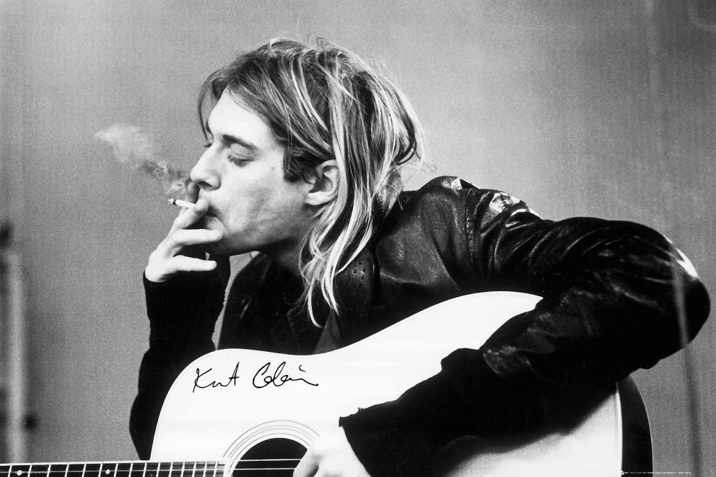 Kurt Cobain smoking with his guitar, in a high-definition black and white wallpaper