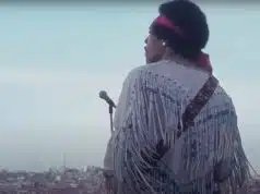 Jimi Hendrix at Woodstock with his iconic jacket.